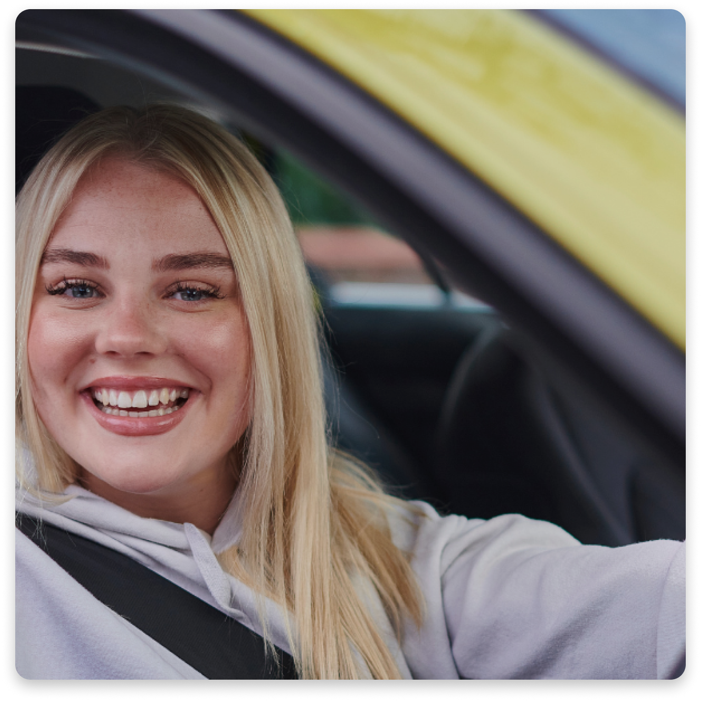 Young Irish girl driving her newly insured car